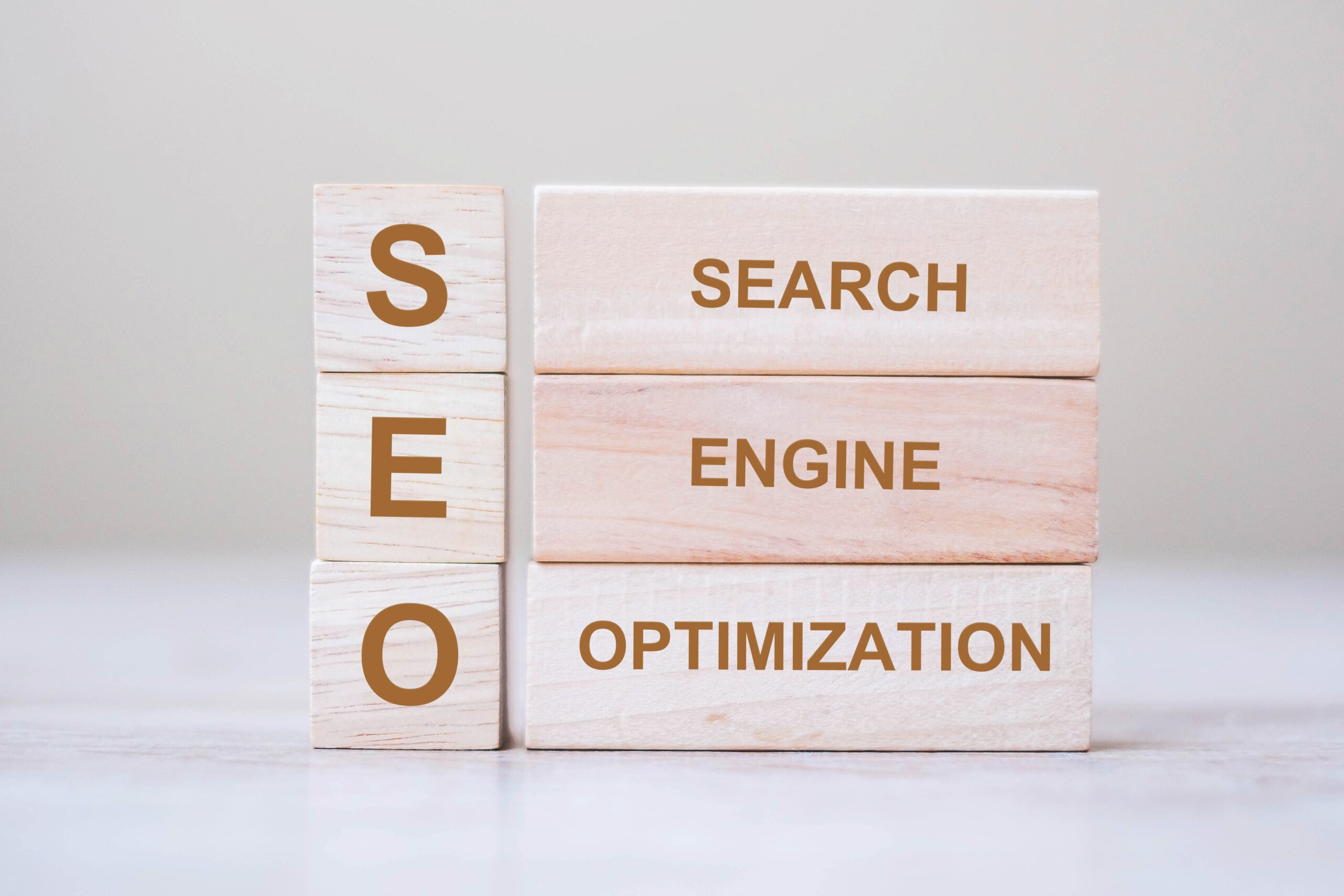 Two stacks of wood blocks. One says SEO, the other says Search Engine Optimization.